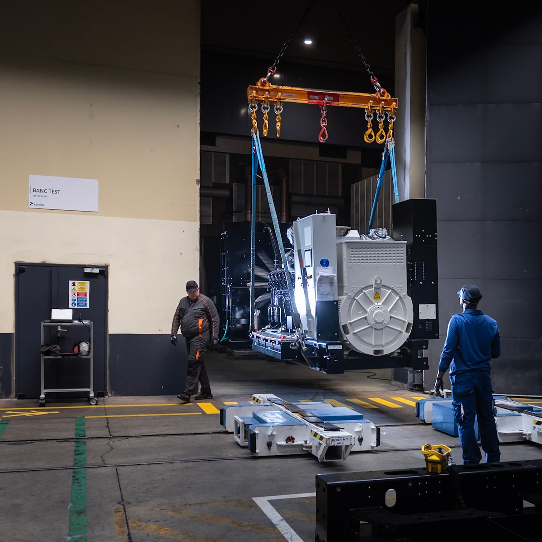 Industrial generator being crane-lifted during factory testing - Data Centers E2E - Card